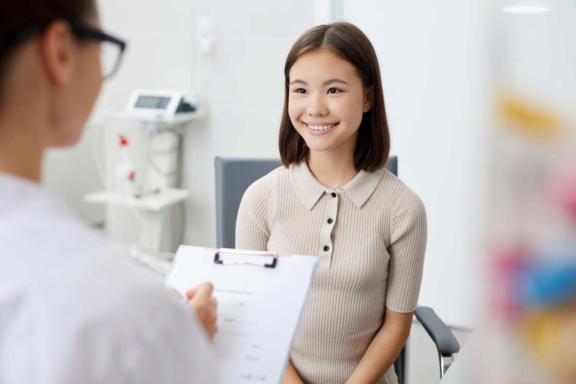 smiling-girl-in-doctors-office-QBNEG28.jpg